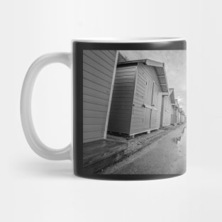 Row of traditional wooden beach huts on the Norfolk coast Mug